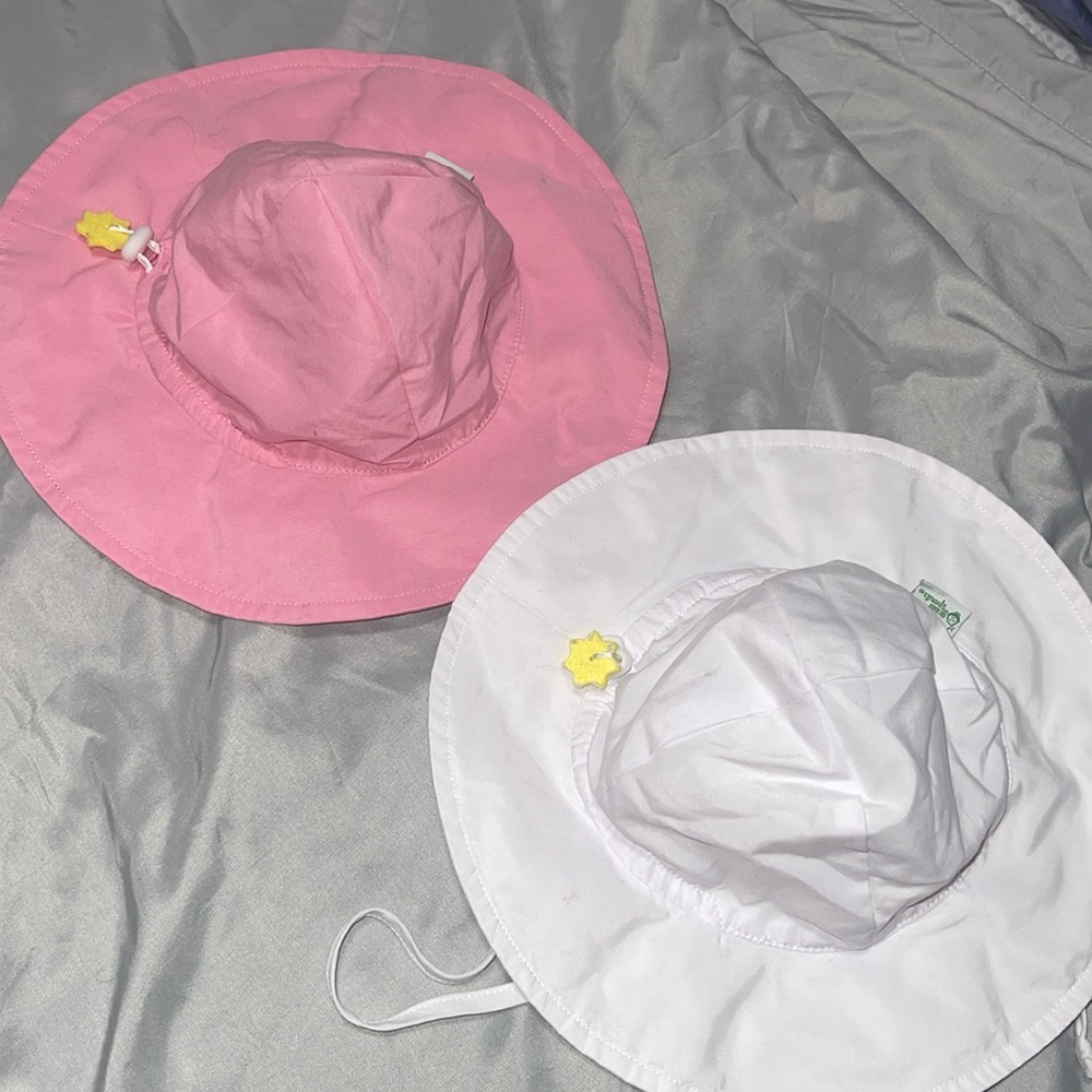 Lot of 2 sun hats x I play. Adjustable string to tighten or loosen fit 0-6 mth